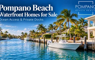 Pompano Beach waterfront homes with private docks, palm trees and a boat along a residential canal.